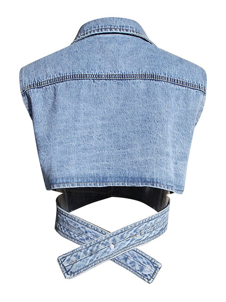 Distinctive two-piece set, a blue denim blouse with an unusual cut, a white loose-fitting long-sleeved shirt and a buttoned-collar