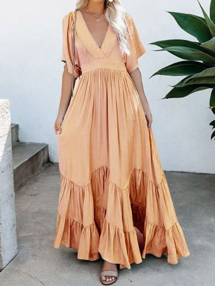 Loose maxi dress with ruffle hem, suitable for daily and beach wear.