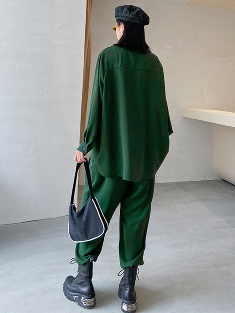 Two-piece suit, with wide-leg pants, signature irregular pleated loose blouse