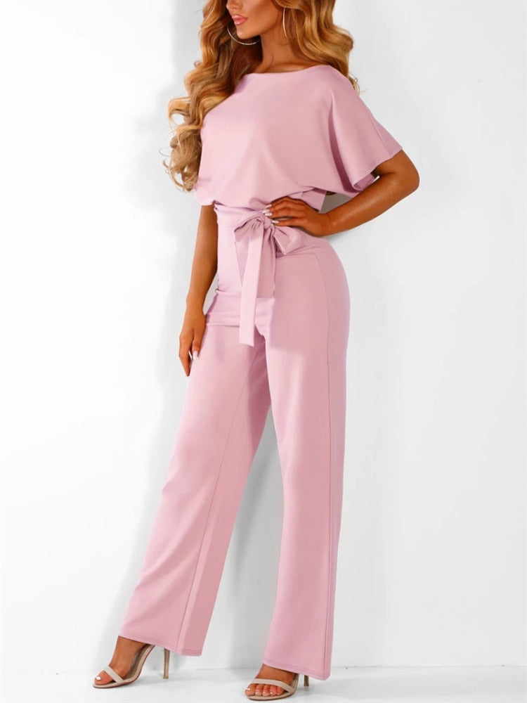 An elegant one-piece jumpsuit with a high waist and short flared sleeves, featured in several colors, with a tie at the waist