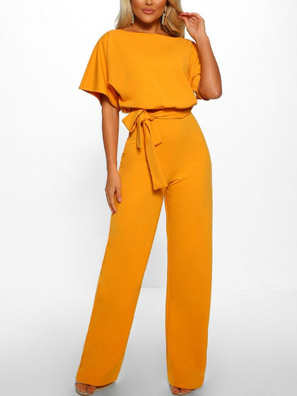 An elegant one-piece jumpsuit with a high waist and short flared sleeves, featured in several colors, with a tie at the waist