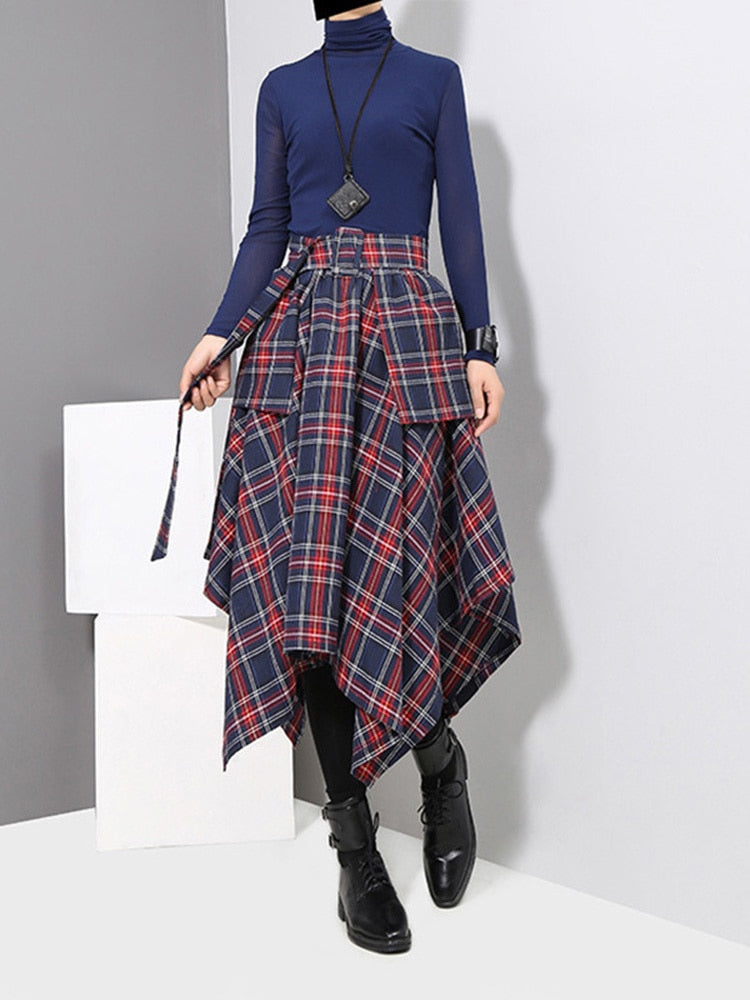 Women's mid-length skirt, with a distinctive cut with triangle layers, and a check print.